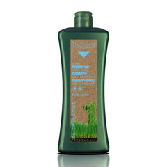 SALERM Biokera Natura Honey Scalp Care Shampoo bottle pouring for gentle cleansing