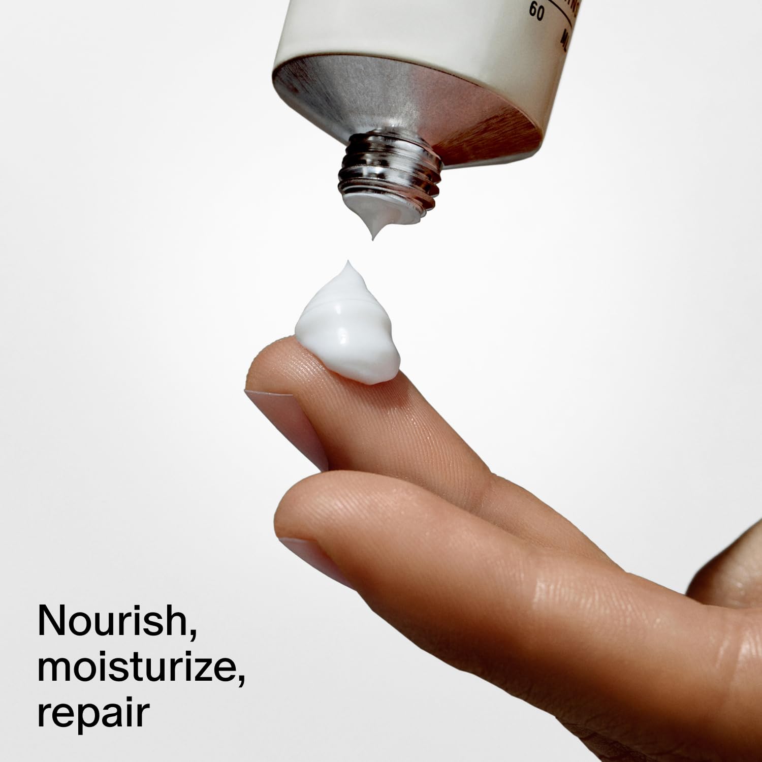 Lotion on hand demonstrating silky, non-greasy finish