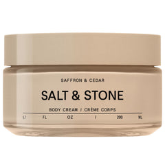 Salt and Stone saffron-cedar bottle showcases a luxurious body cream with lasting hydration.