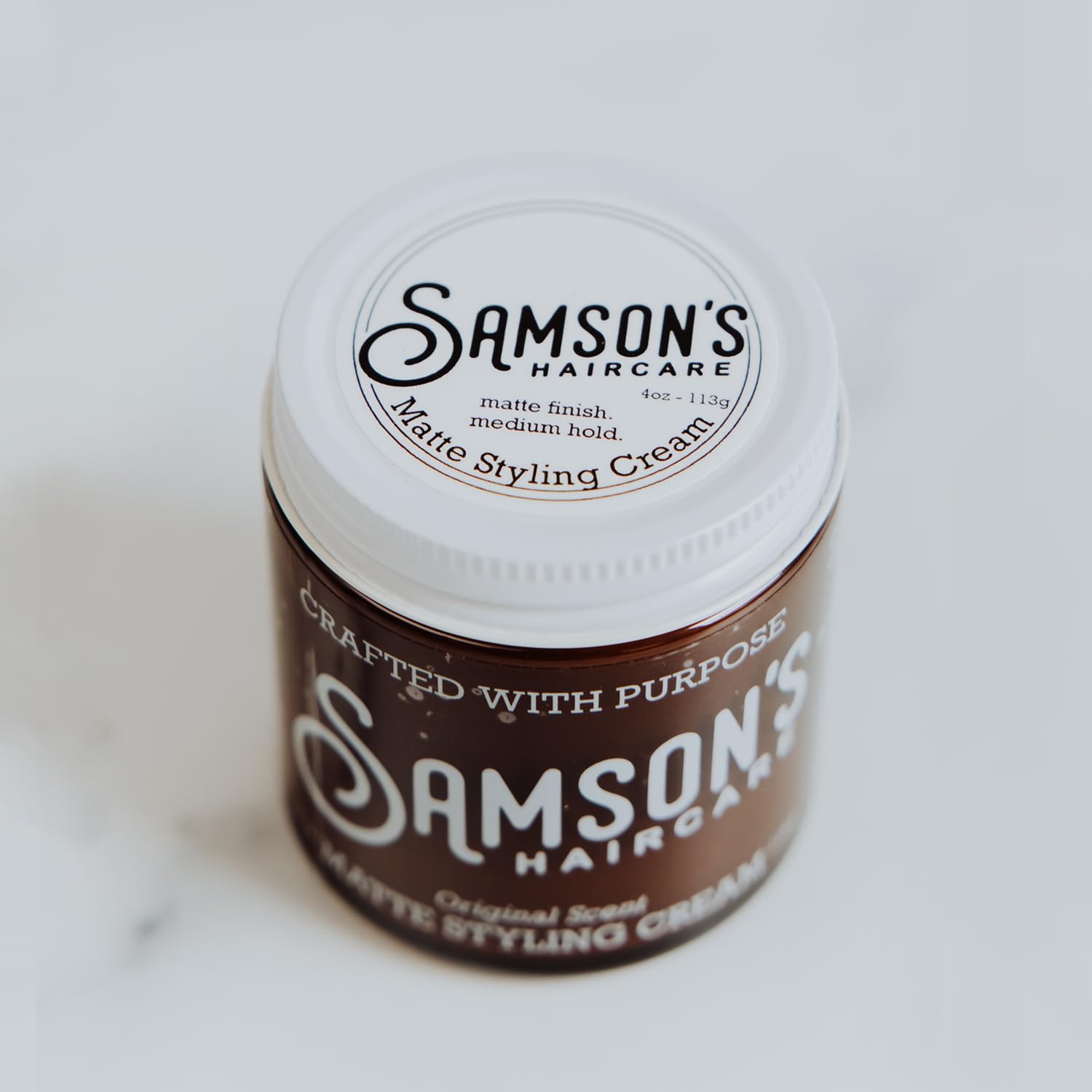 SAMSON'S HAIRCARE Matte Styling Cream being applied for quick, no-shine hold.