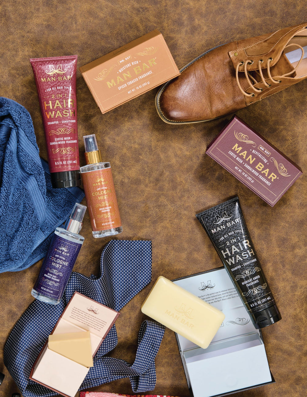 Hand applying MAN BAR mist, ready for on-the-go refreshment.