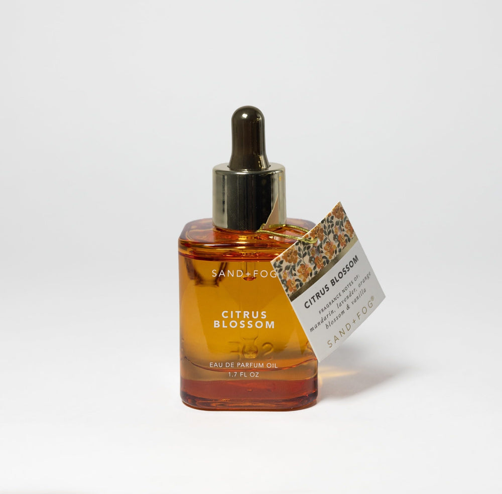 Sand + Fog Citrus Blossom amber glass packaging protects the oil and elevates vanity appeal.