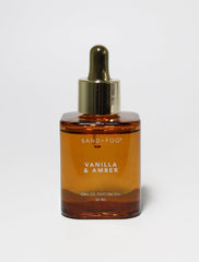 Sand + Fog Vanilla & Amber oil bottle with dropper enables intimate fragrance use.