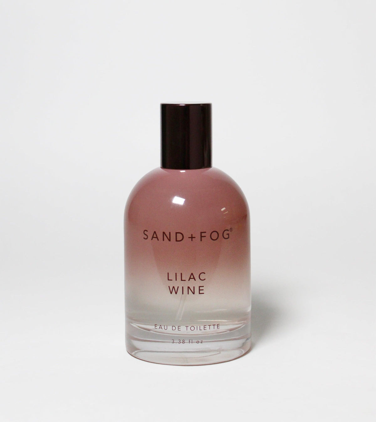 Sand + Fog Lilac Wine EDT bottle gradient highlights chic design for daily wear.