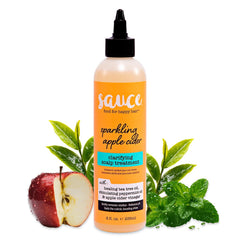 Sauce Beauty Clarifying Scalp Treatment bottle pour for balanced scalp and renewed shine.