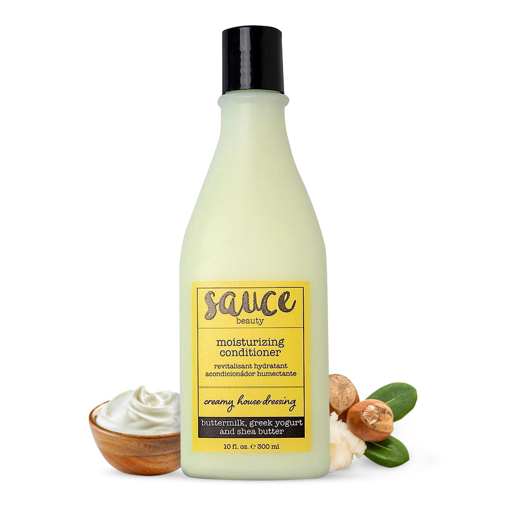 SAUCE BEAUTY Creamy House Dressing Conditioner bottle pour showing light moisture for frizz control.