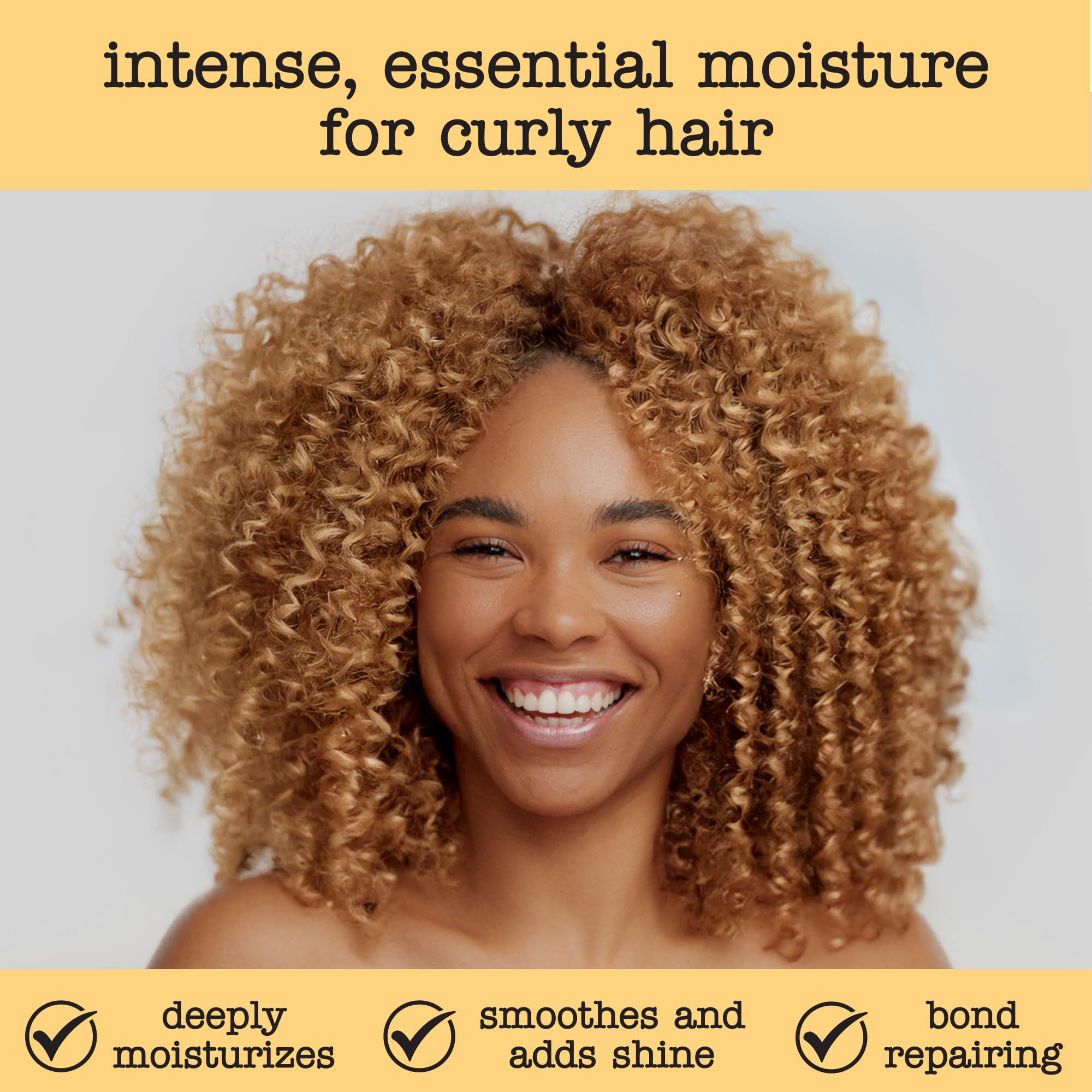 Hands applying SAUCE conditioner for smooth, detangled curls