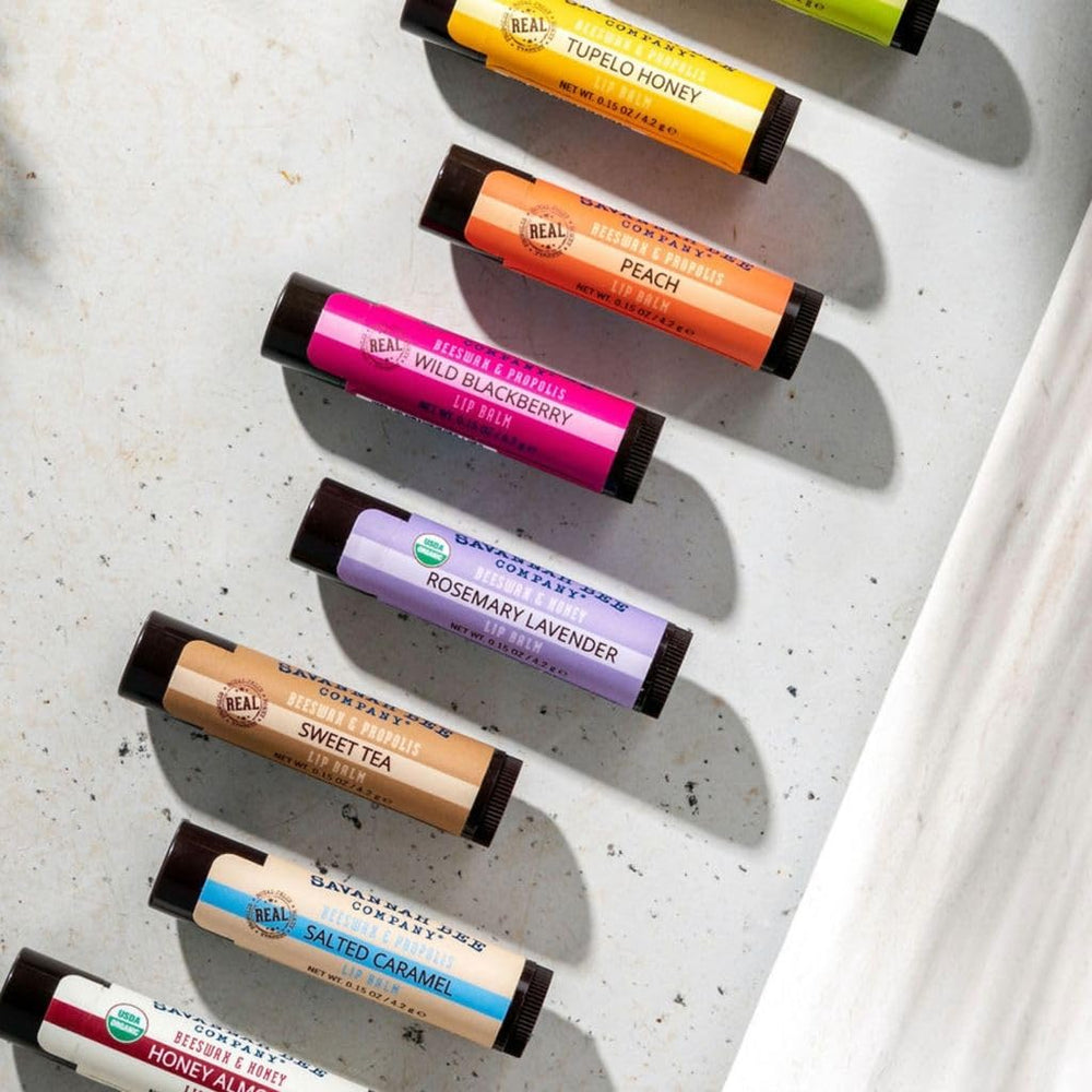 Application glide of Savannah Bee lip balm on lips.