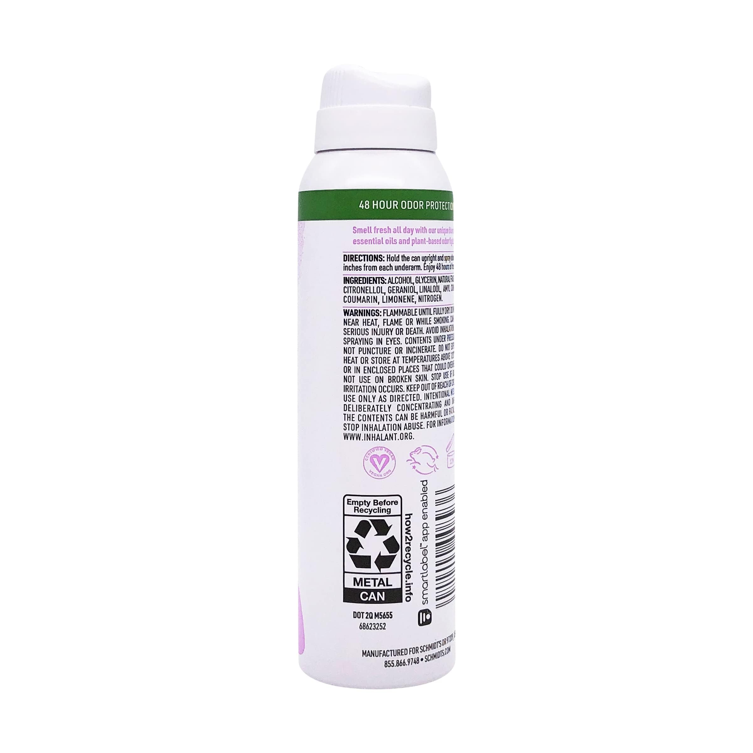 Schmidt's Clean Powder Deodorant travel-sized bottle beside carry-on