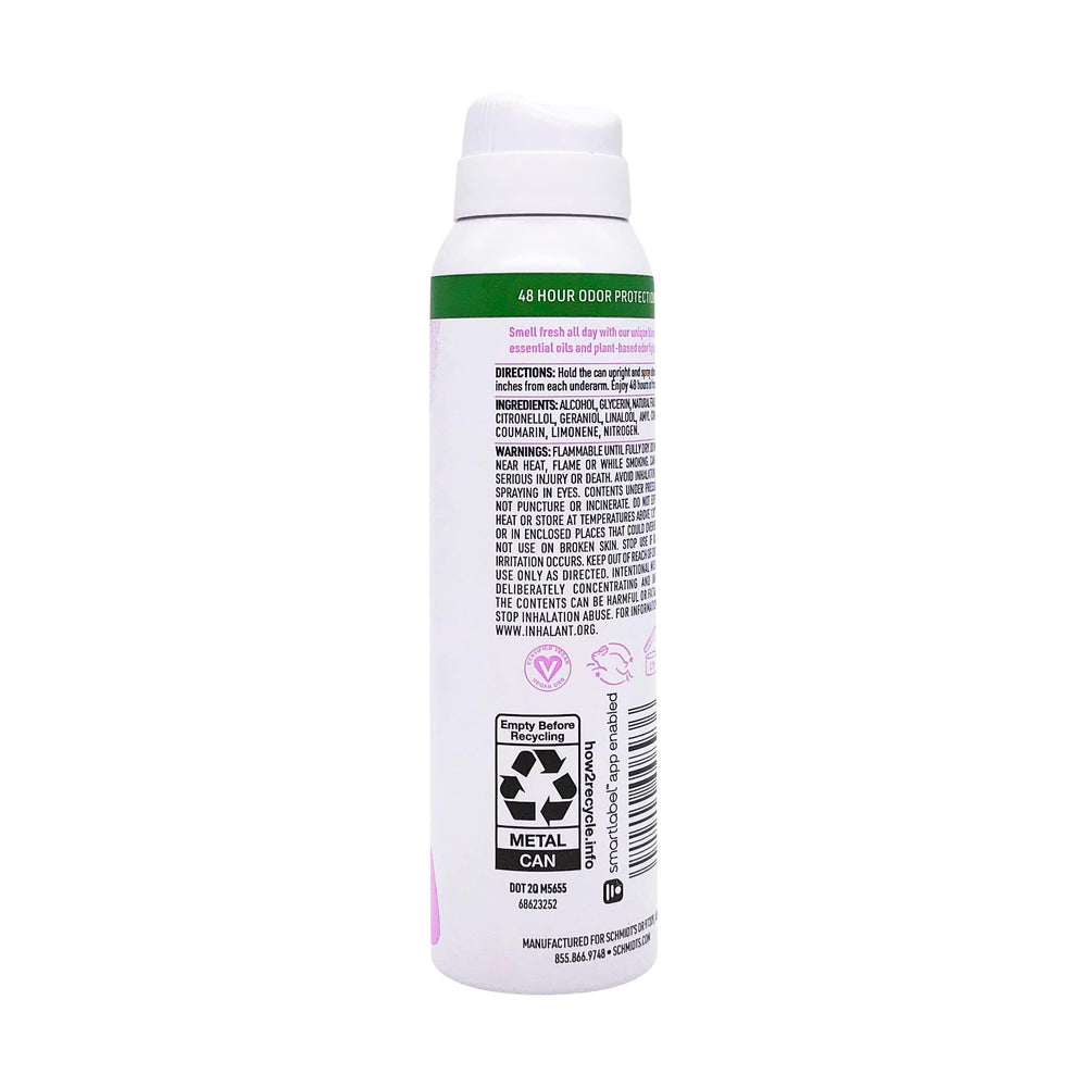 Schmidt's Clean Powder Deodorant travel-sized bottle beside carry-on