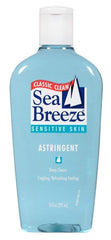 Seabreeze Sensitive Skin Astringent bottle pour for a refreshing cleansing experience.