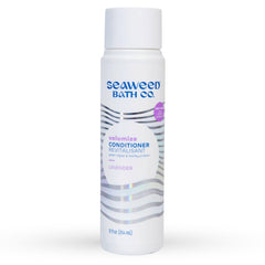 Seaweed Bath Co. Volumize bottle pour demonstrates thickening action with seaweed and barley for fine hair.