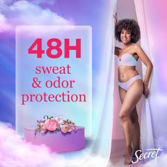 Applying Secret Dry Spray underarm demonstrates quick-dry, long-lasting freshness