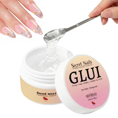 Secret Nails GLUI bottle close-up showing extra-strong hold for daily wear.