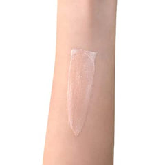 Seraphine Camelina + Strobe primer dispenser demonstrates gentle glow application.