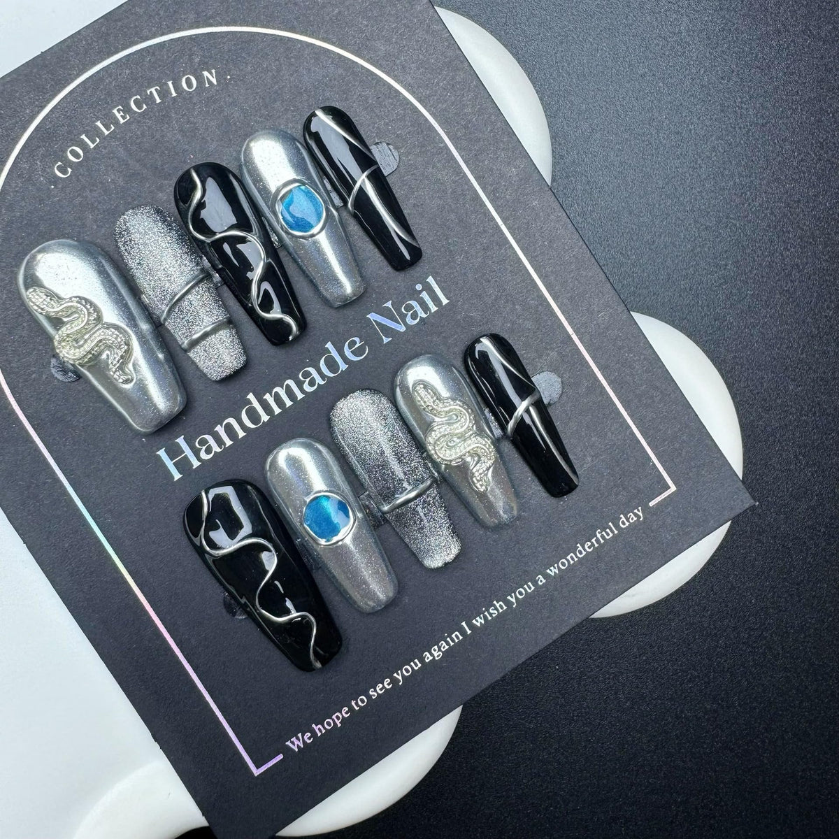 Sevgob 5D embossed nails with snake charms for quick at-home nail art.