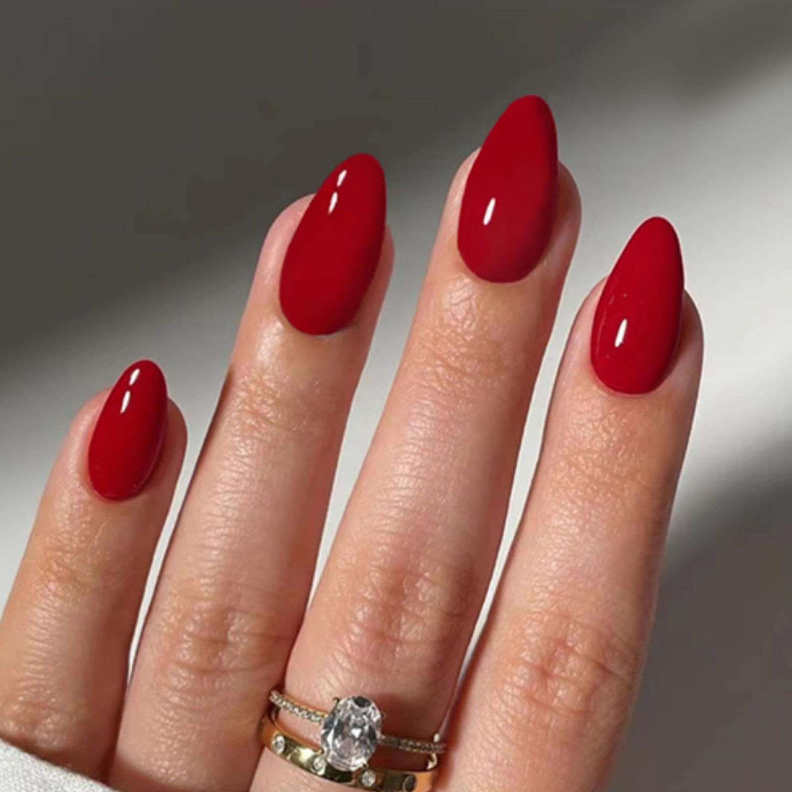 Sevgob red press-on almond nails package contents for quick manicure.