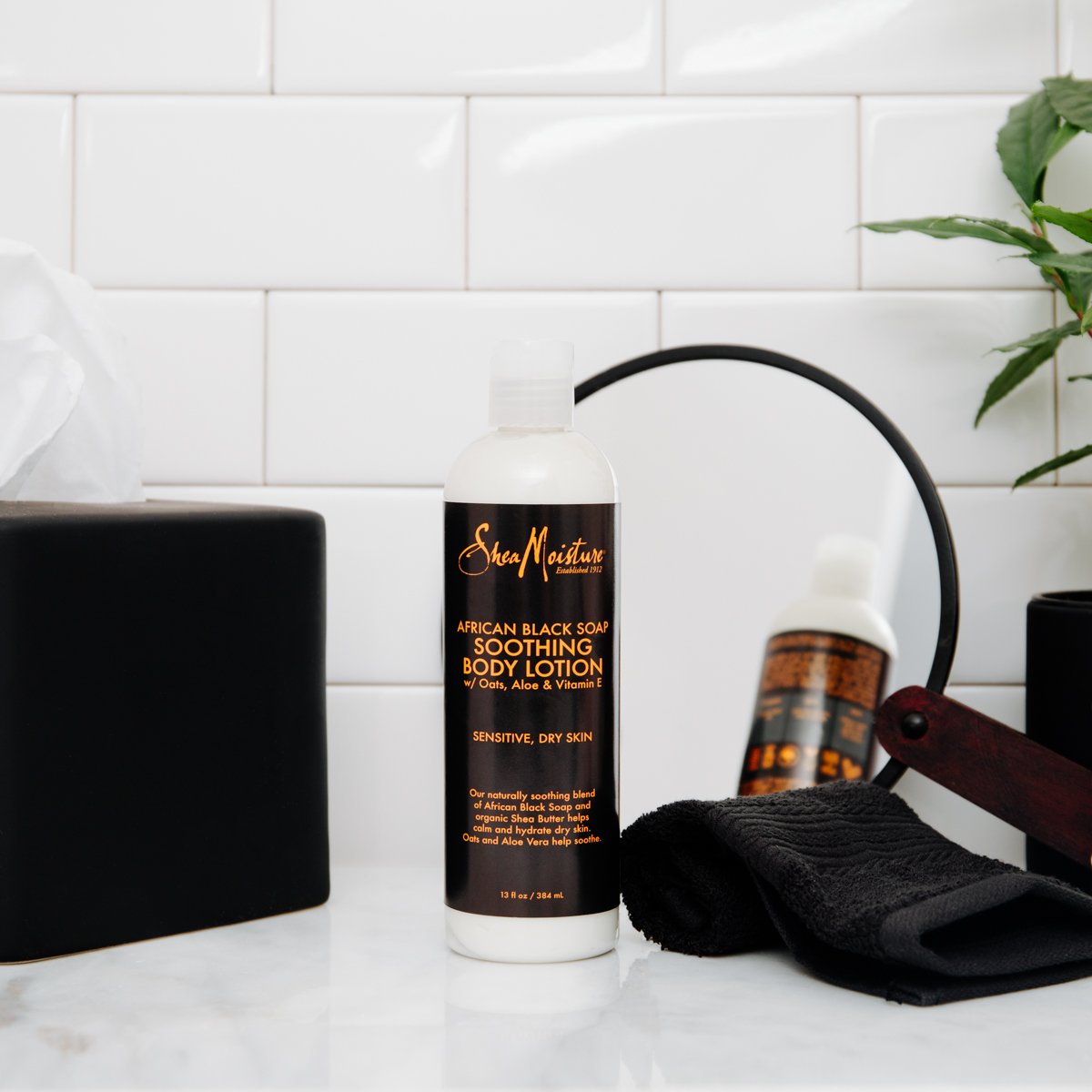 Creamy texture gliding on damp skin demonstrates easy absorption.