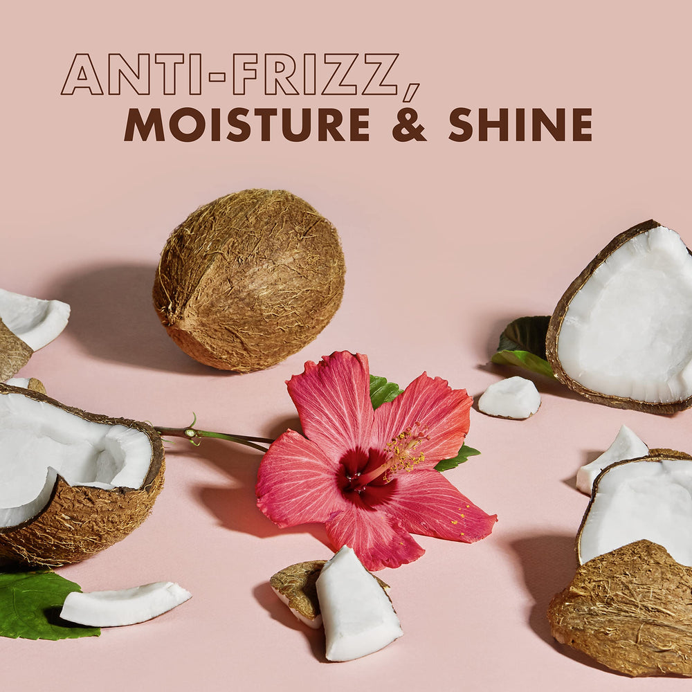 Applying Sheamoisture Coconut Hibiscus to damp hair for twists