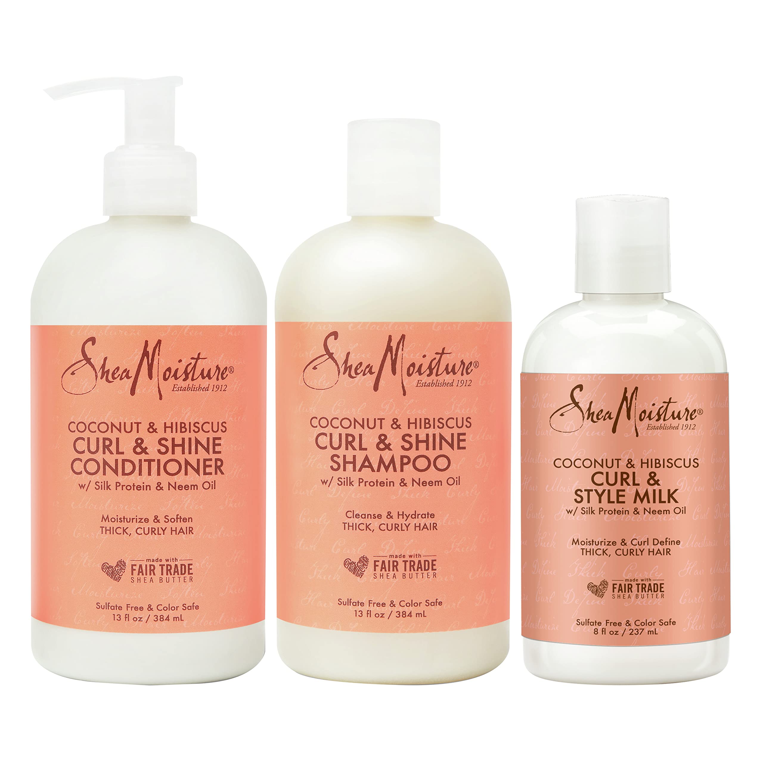 SheaMoisture Coconut Hibiscus Shampoo bottle demonstrates hydrated, bouncy curls.
