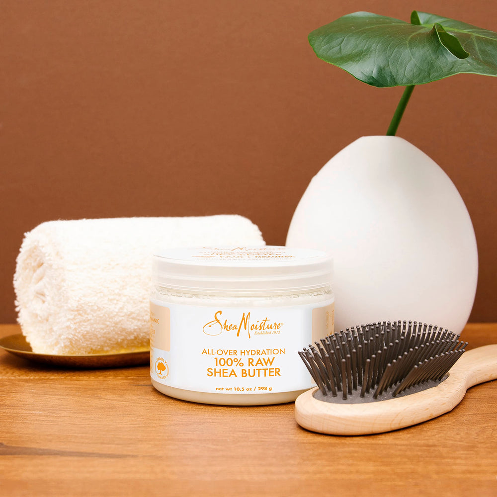 Hydrating lips with SheaMoisture butter for comfort.