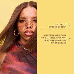 Application of Sheamoisture Strengthen & Restore conditioner on damp hair for nourishment