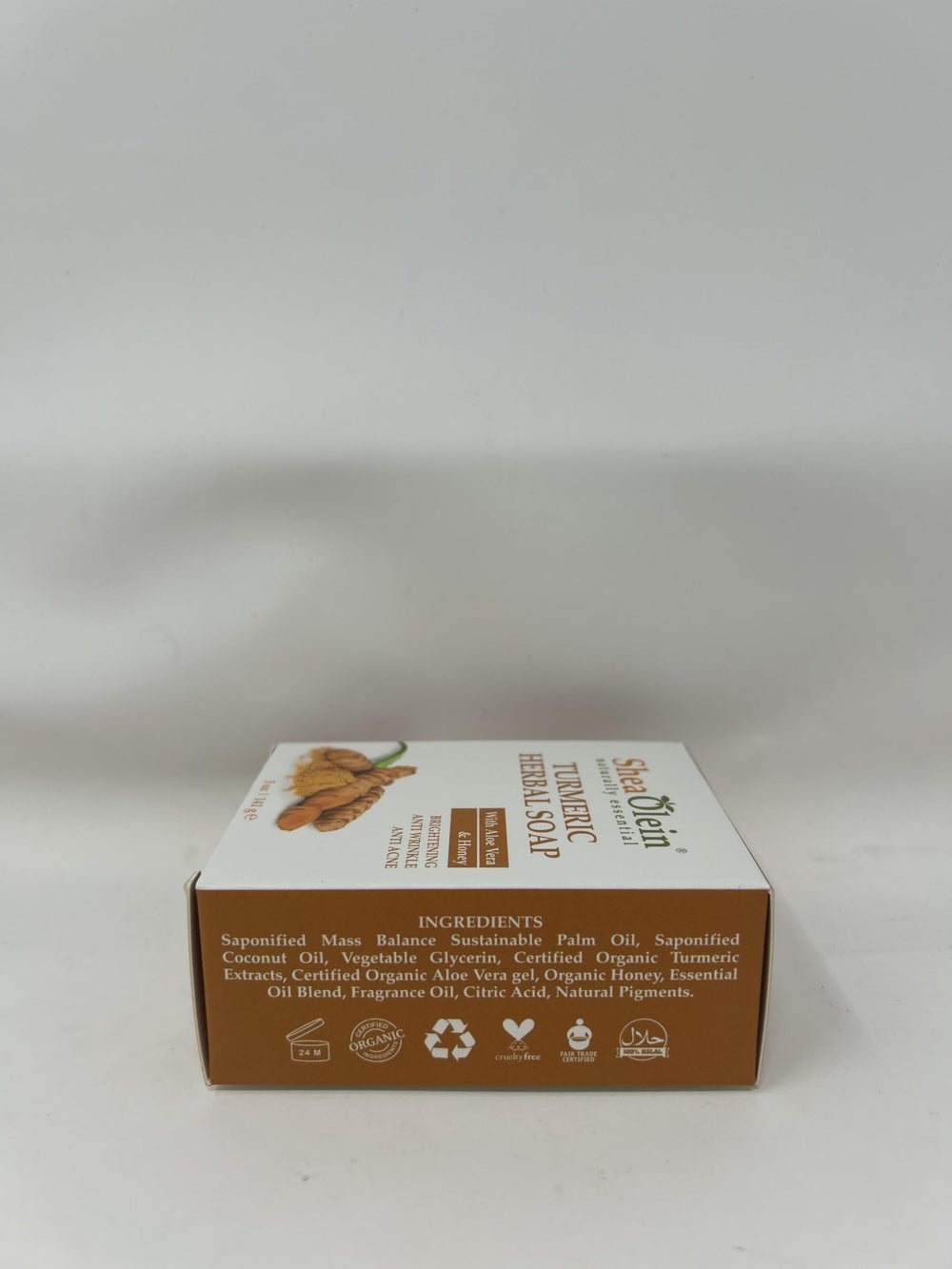 SheaOlein turmeric herbal soap in shower-ready packaging
