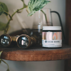 Shear Revival Loyal Styling Balm Pomade being applied to hair for gentle hold and conditioning.