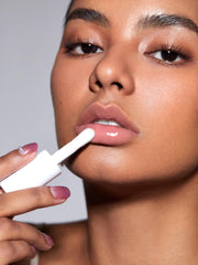 SHEGLAM Jelly Wow lip oil on lips emphasizes hydrating glossy texture.