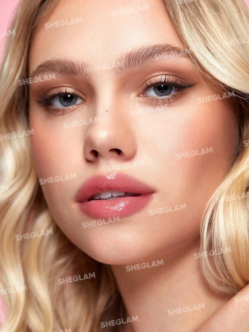 SHEGLAM Jelly Wow Lip Oil close-up highlights hydration with a non-greasy finish.