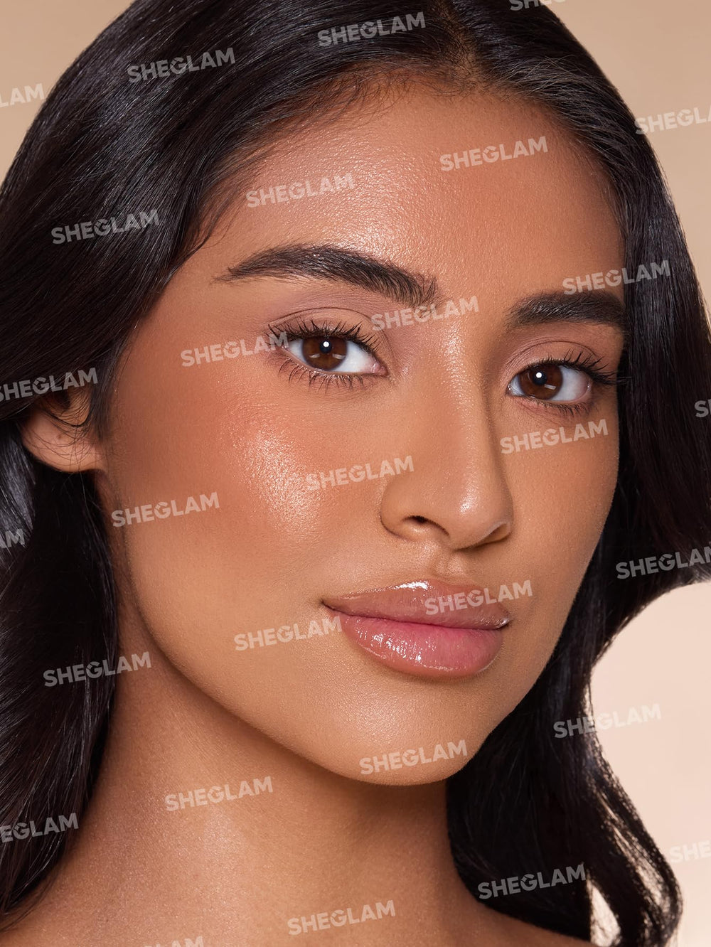 SHEGLAM Sun Beam Shimmer Bronzer Mud Pie swatch on cheek reveals natural blend