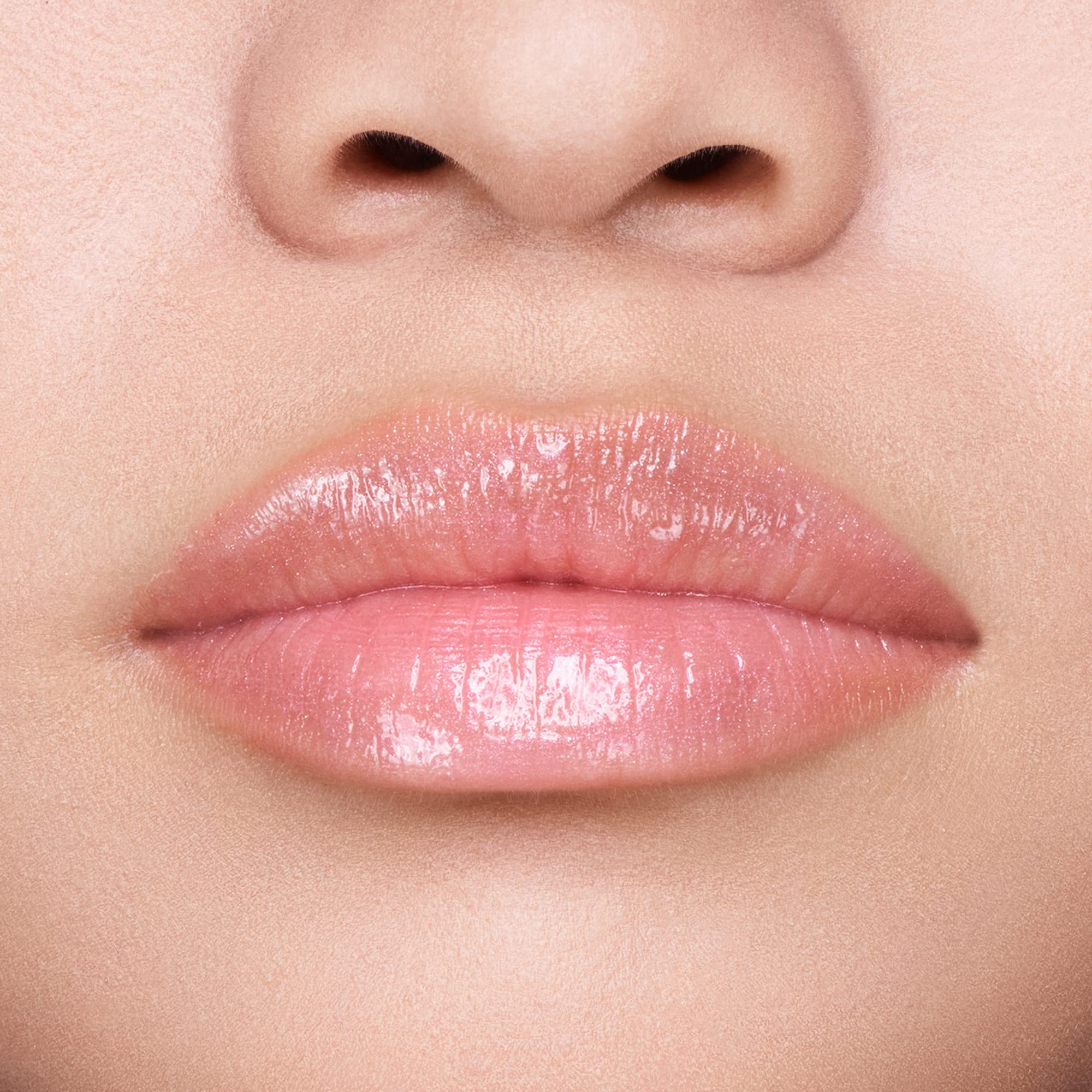 Application of Shiseido GelGloss Bare Pink 04 as a topcoat over color