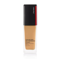 Shiseido Synchro Skin self-refreshing foundation bottle pour for even, effortless application.