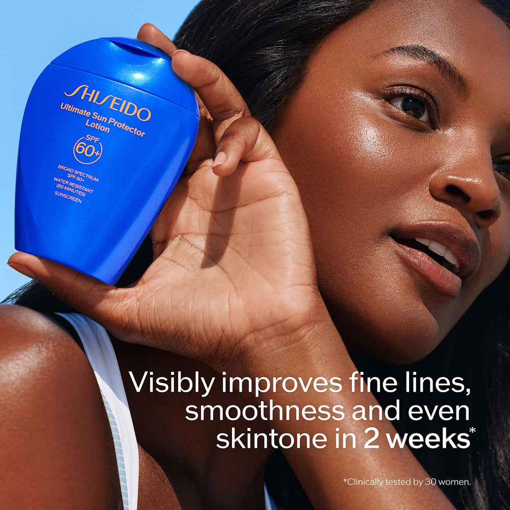 Shiseido Ultimate Sun Protector Lotion hands-application closeup reveals smooth skin feel.