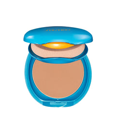 Close-up of Shiseido UV Protective Compact texture showing powdery finish.