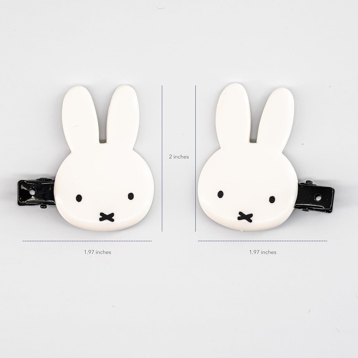 SHOBIDO Miffy die-cut bangs clip held in hand for scale and feel.