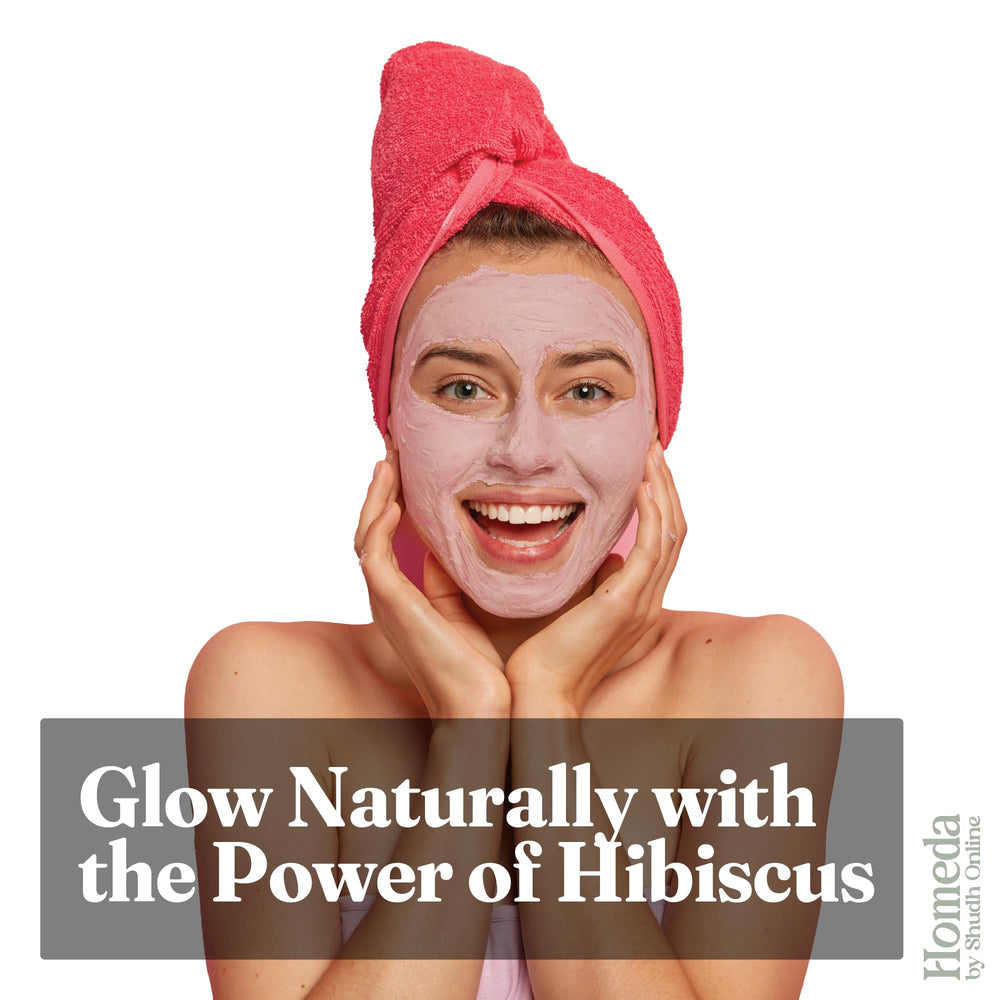 Fresh hibiscus leaves and flowers underscore natural origin and purity.