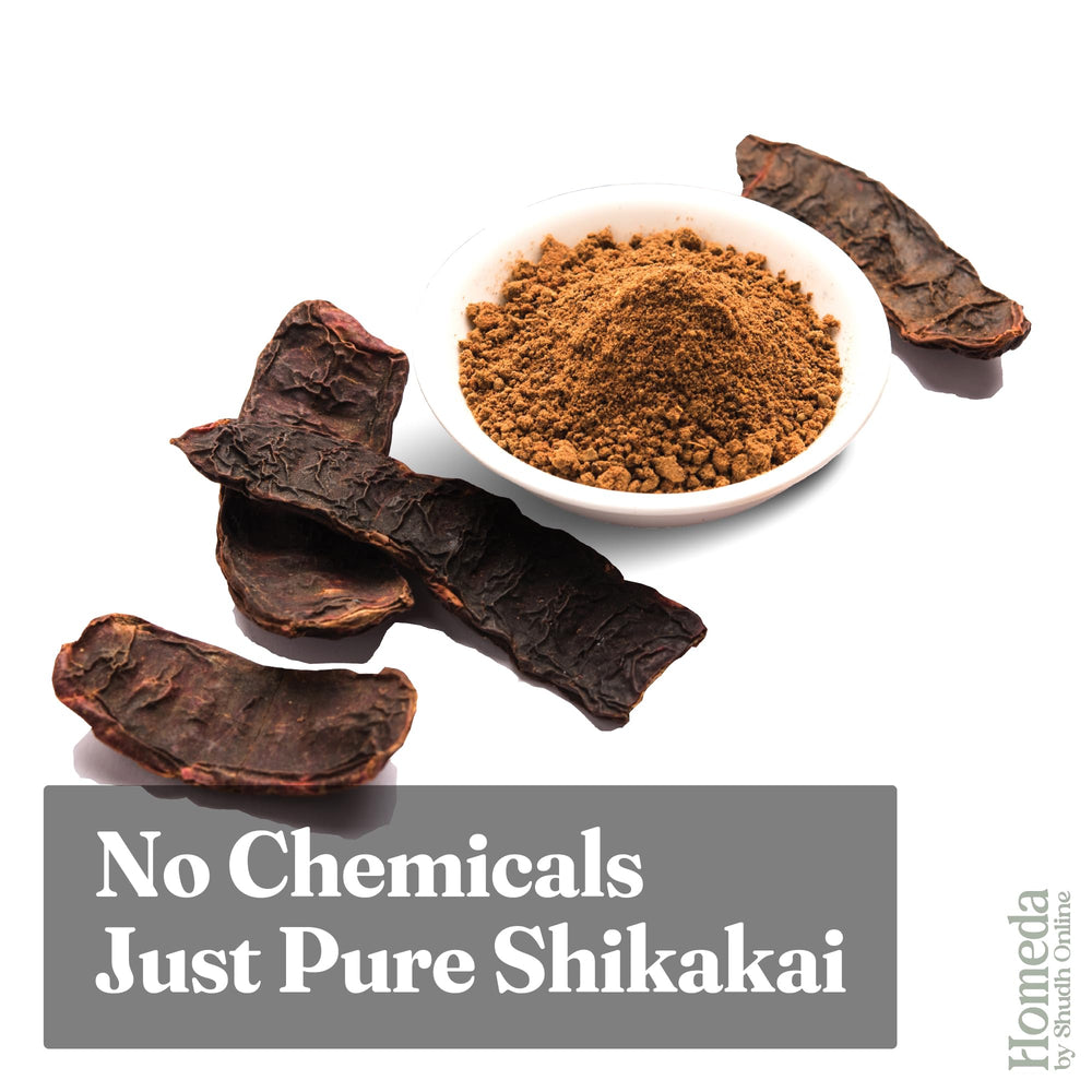 Shudh Online Shikakai powder applied to scalp in a rinse-ready mix.