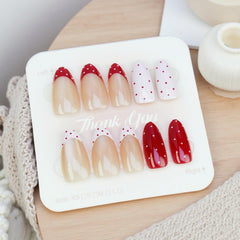 SHUXILIN red French tip nails with glossy finish for chic style and shine.