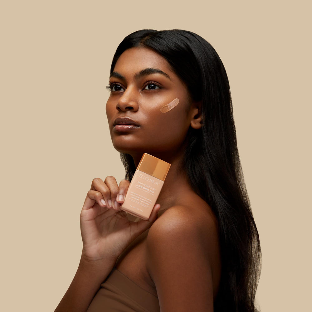 Sigma Beauty Skin Perfector dewy finish appears with a sheer to medium tint.