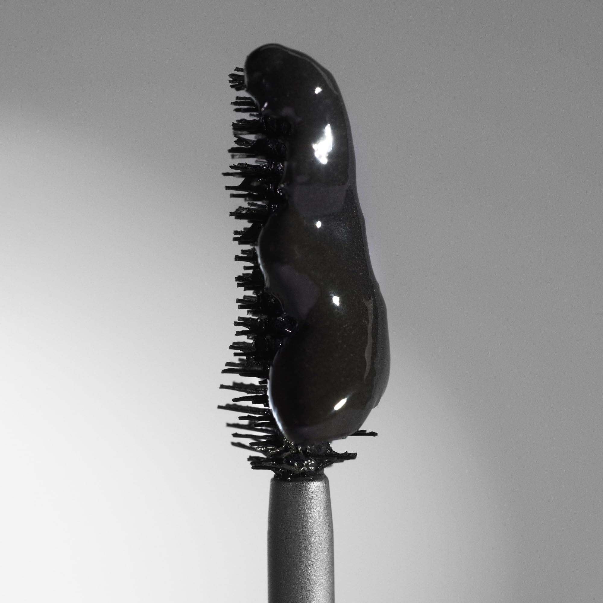 Deep black Phyto-Noir formula coating lashes for bold look.