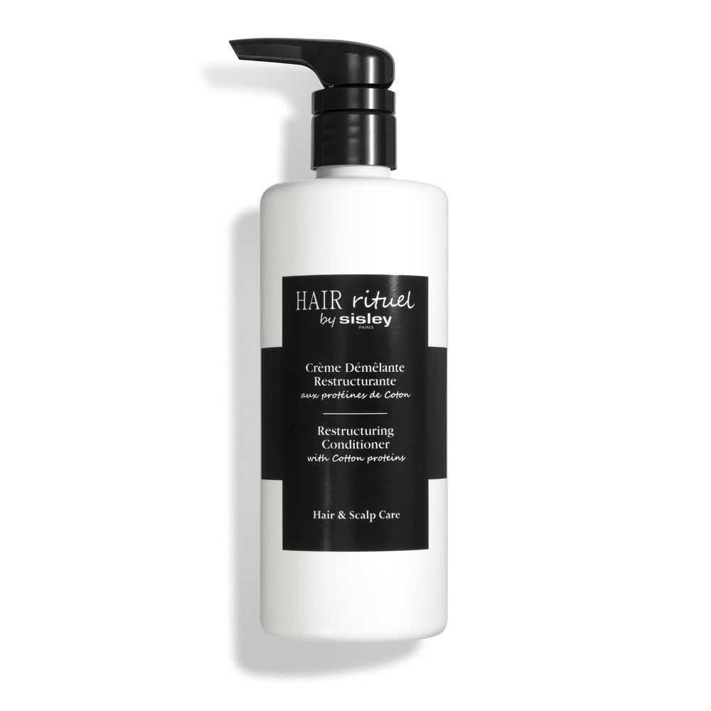 Sisley Paris Restructuring Conditioner bottle with cotton proteins aiding detangling