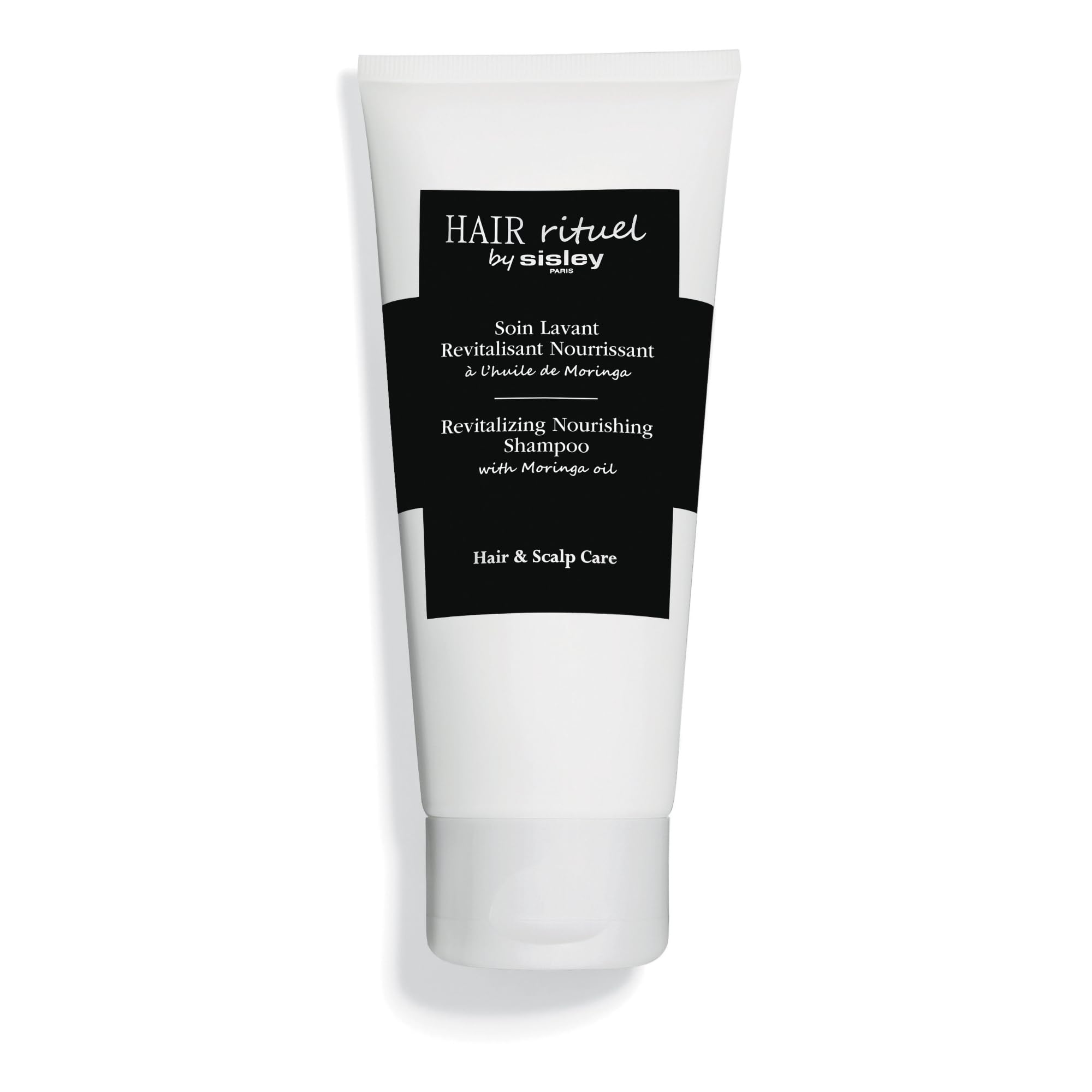 Sisley Paris Revitalizing Nourishing Shampoo bottle with Moringa Oil for moisturizing care