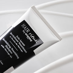 Scalp massage scene with Sisley Paris shampoo highlighting soothing care