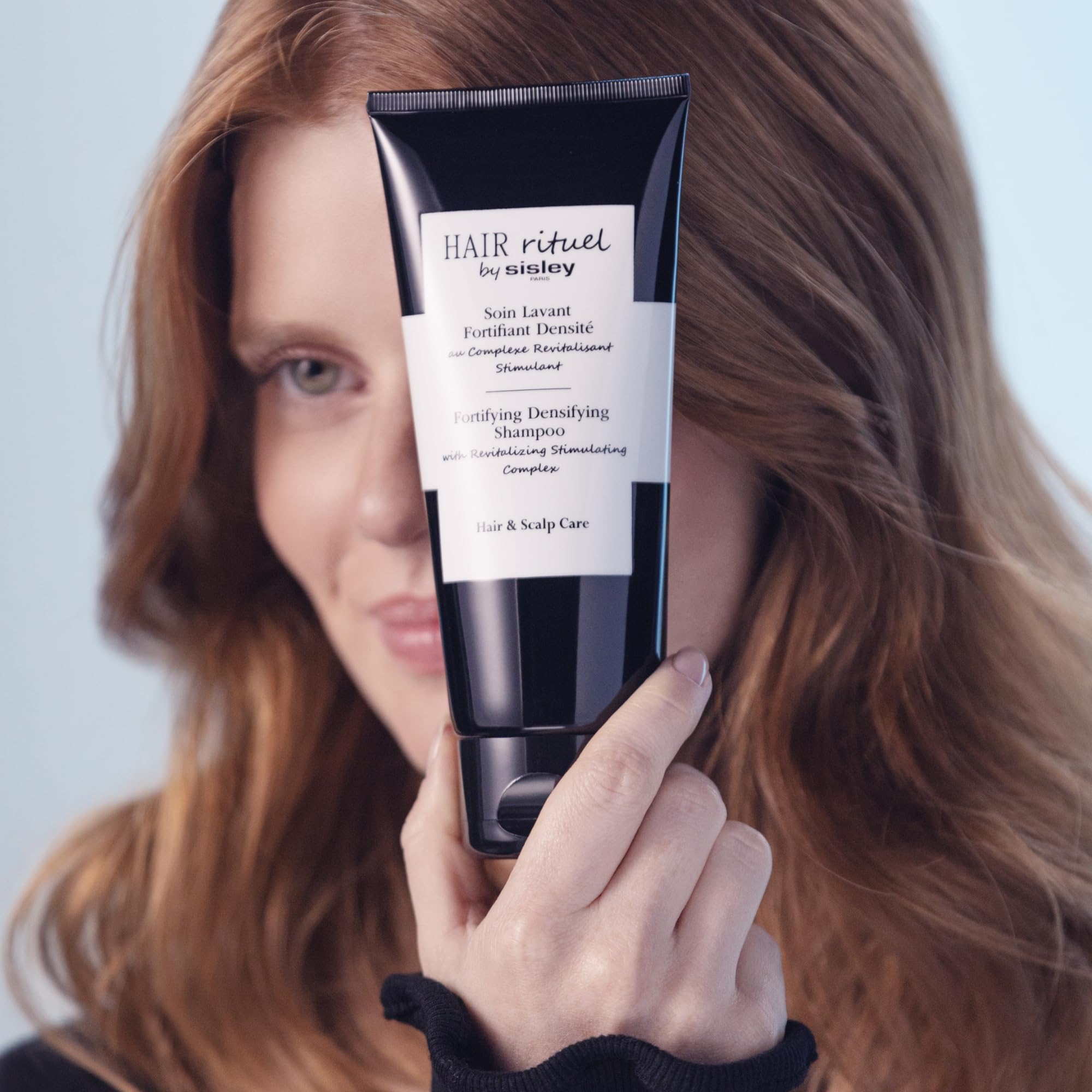 Sisley Paris Revitalizing Stimulating Complex ingredients shown, supporting vitality from the root