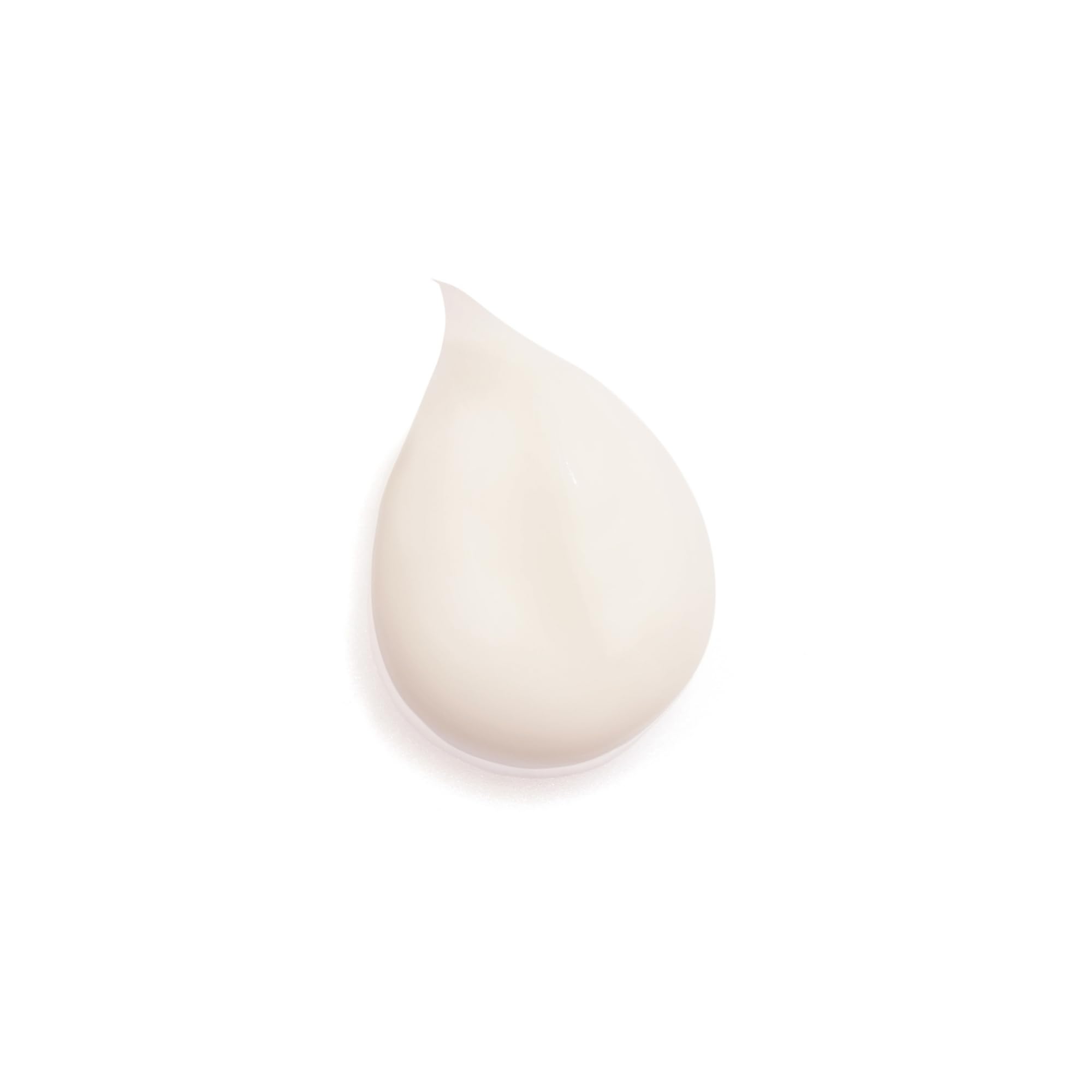 Close-up of applying Sisleya Integral Eye Cream around the eye contour for smooth skin.