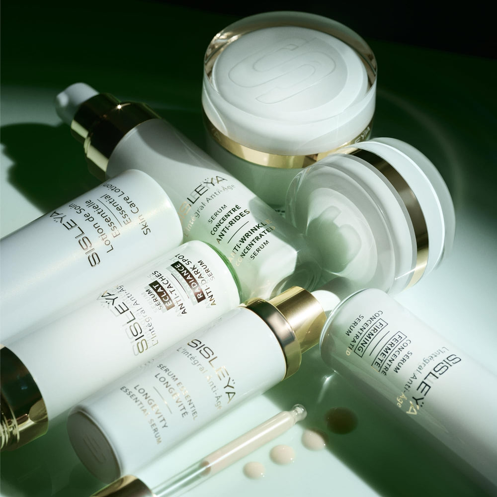 Morning skincare routine with Sisley Paris serum dropper for daily anti-aging prep.