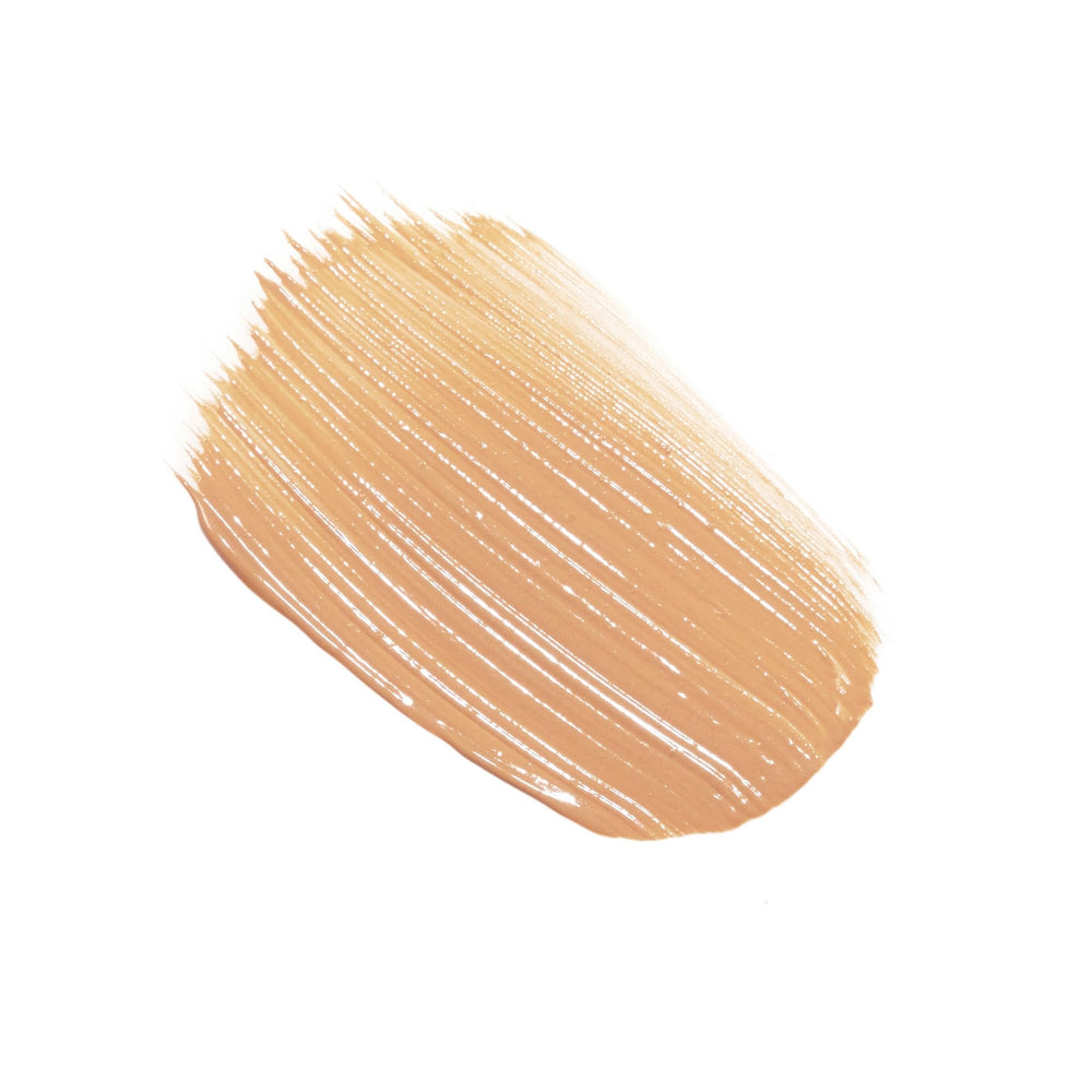 Sisley Paris tinted sunscreen cream application close-up demonstrating sheer glow and even skin tone