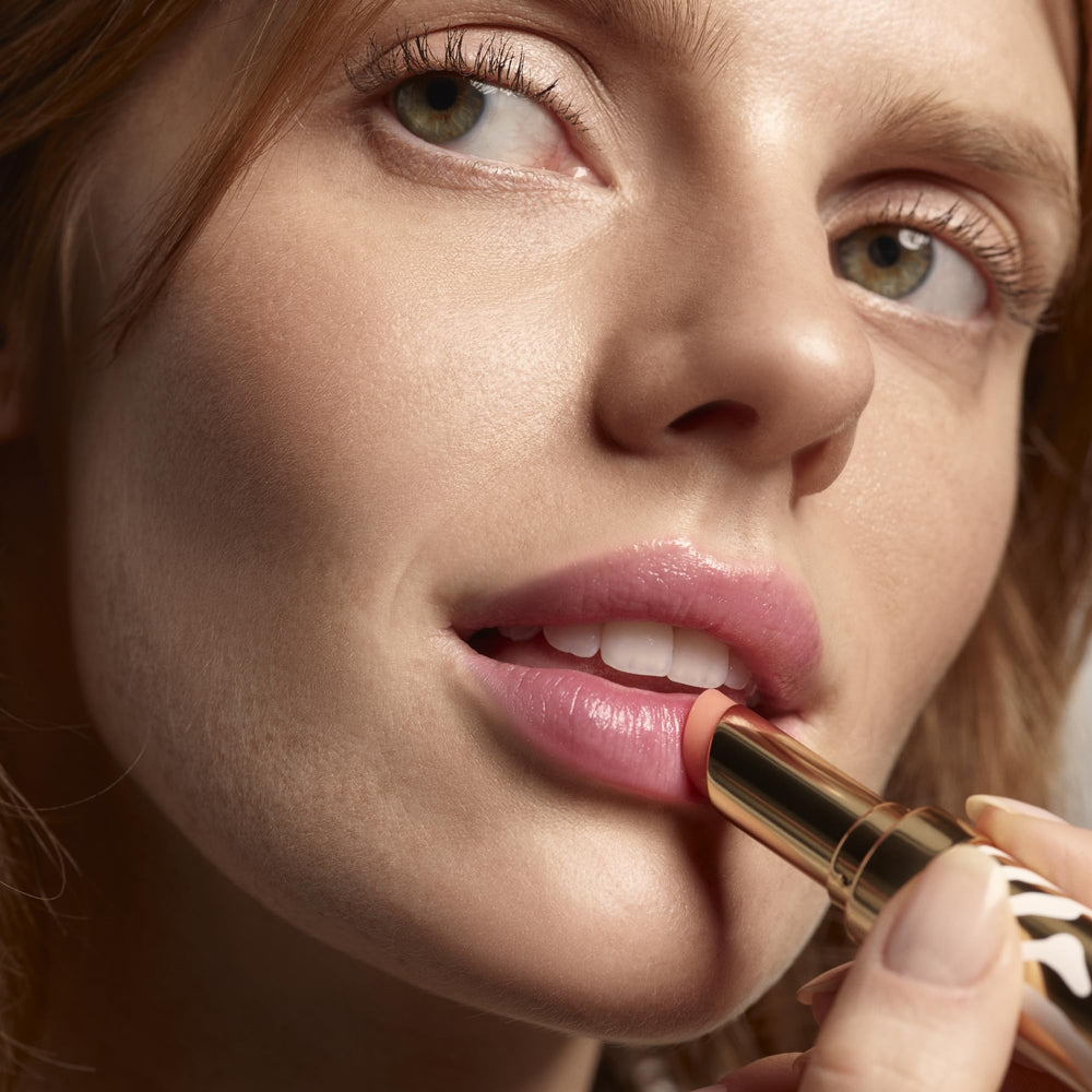Sisley Phyto-Lip Balm being applied on lips for smoothing
