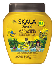 Pouring bottle of SKALA Mais Cachos 2-in-1 cream for leave-in or rinse-out use.